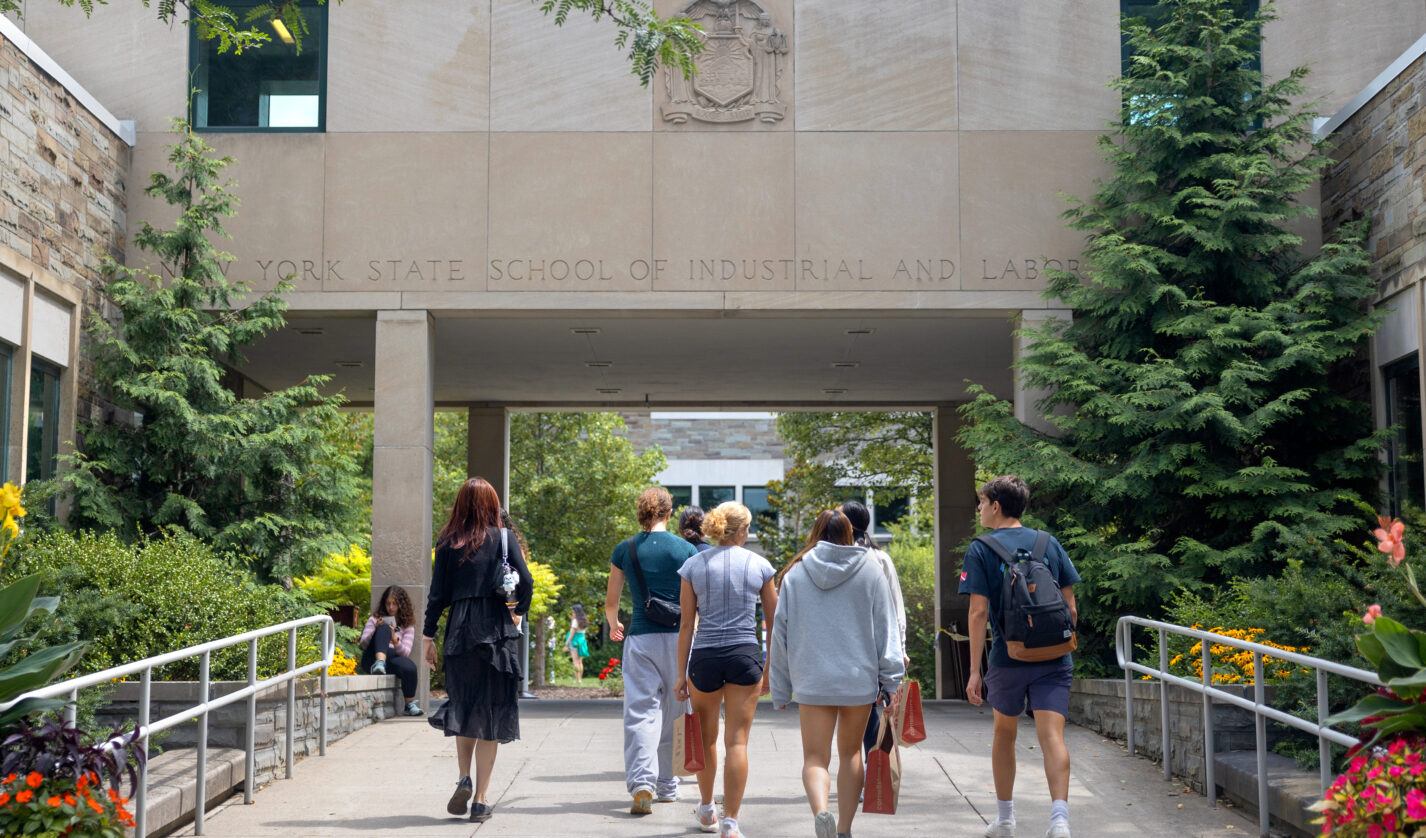 Students walk towards the Ives courtyard at the ILR School.